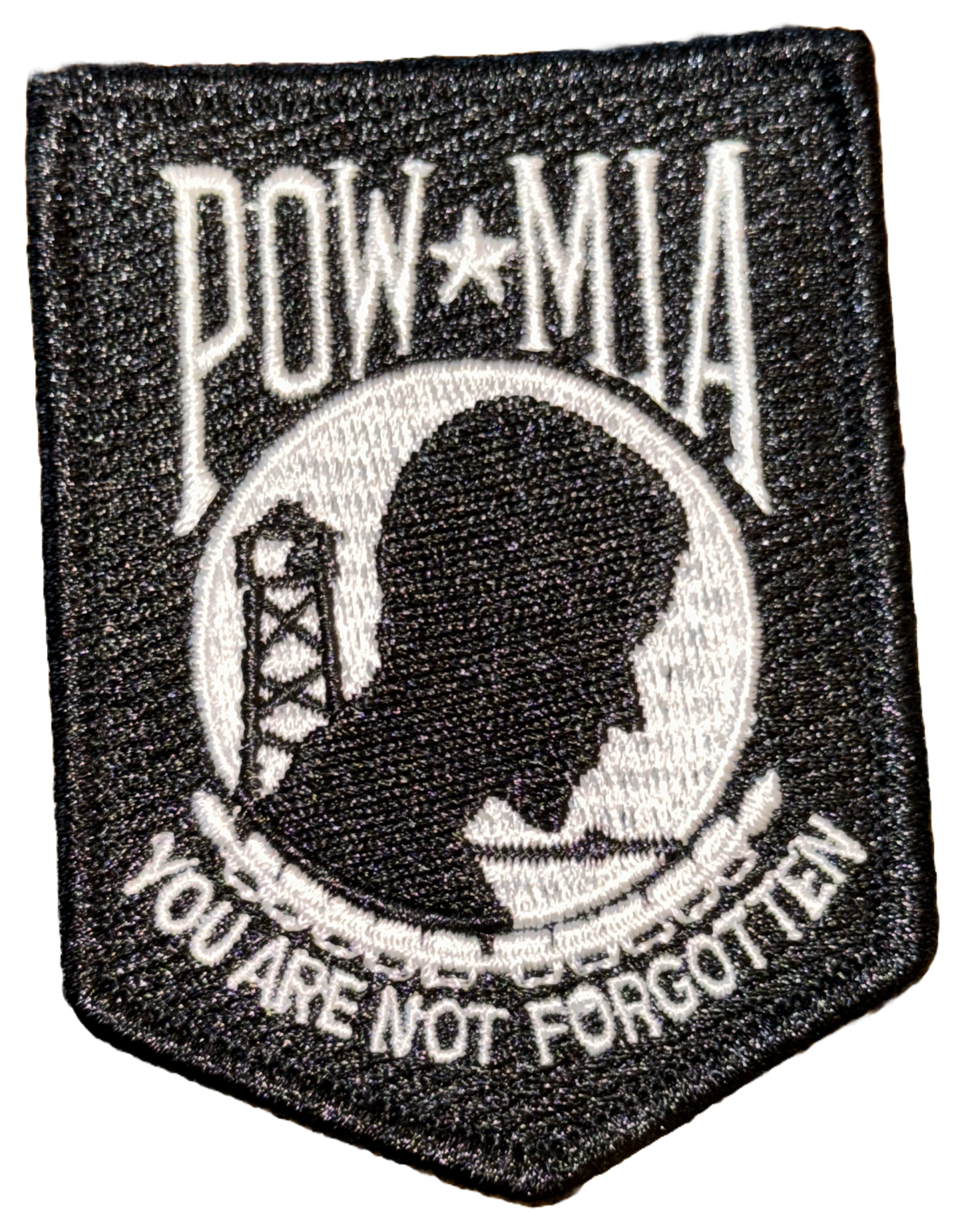 Black POW/MIA patch features the emblem of the National League of Families of American Prisoners and Missing in Southeast Asia with the words "POW MIA You are not forgotten"